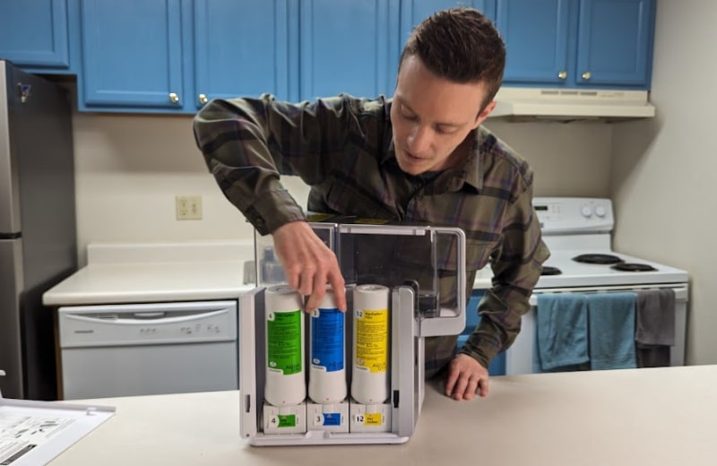 Brian installing the filter cartridges of AquaTru Countertop RO System Brian installing the filter cartridges of AquaTru Countertop RO System